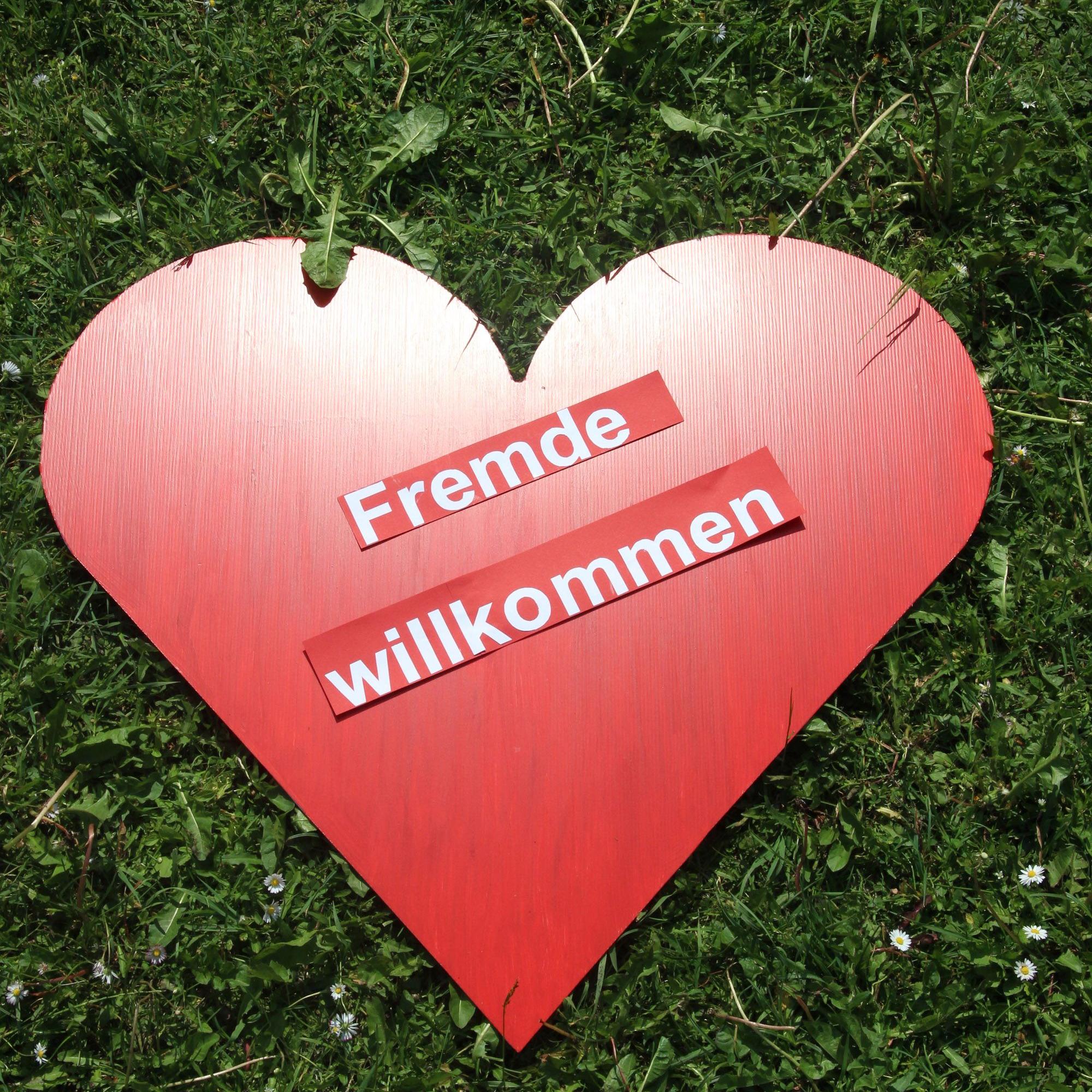 Fremde willkommen