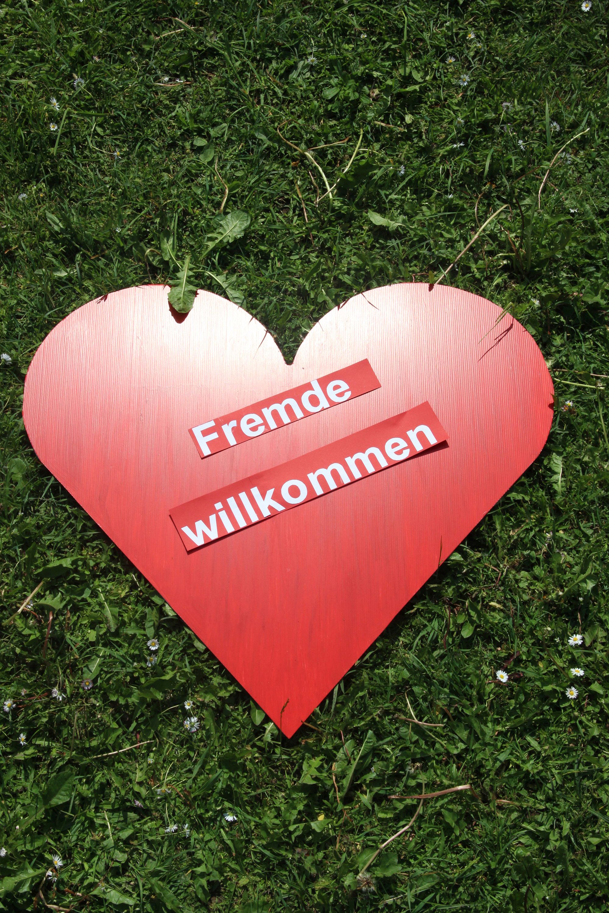 Fremde willkommen